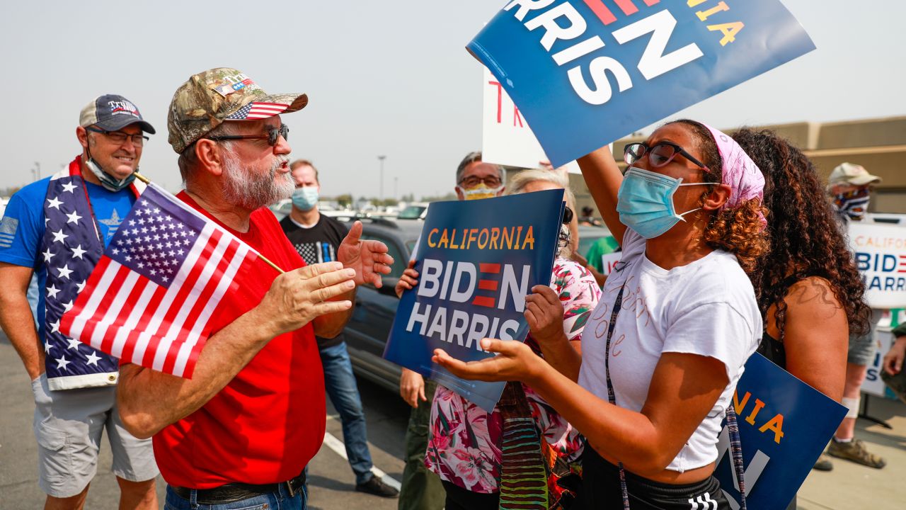 A Donald Trump supporter argues with a Joe Biden supporter outside Sacramento McClellan Airport in California, September 14, 2020.