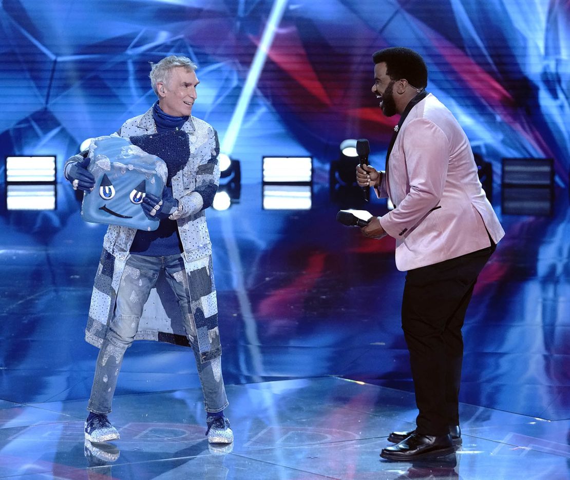Bill Nye The Science Guy and host Craig Robinson in the "Group B Premiere - New Year, New Mask! (Who Dis?)" episode of "The Masked Dancer."
