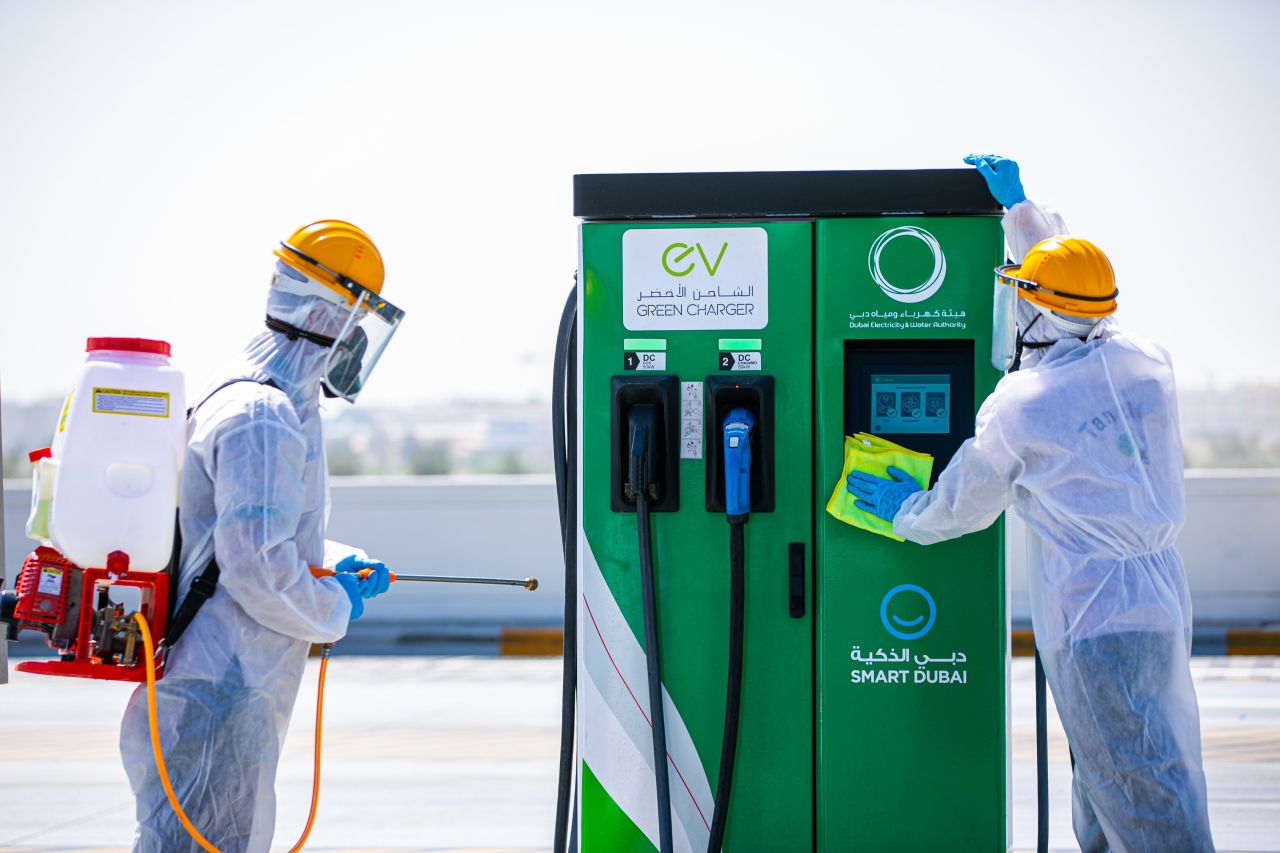 A Green Charger station operated by the Dubai Electricity and Water Authority (DEWA) is disinfected in May 2020. DEWA charging stations for electric vehicles have been rolled out across the emirate and are free to use for Dubai-registered vehicles until the end of 2021.