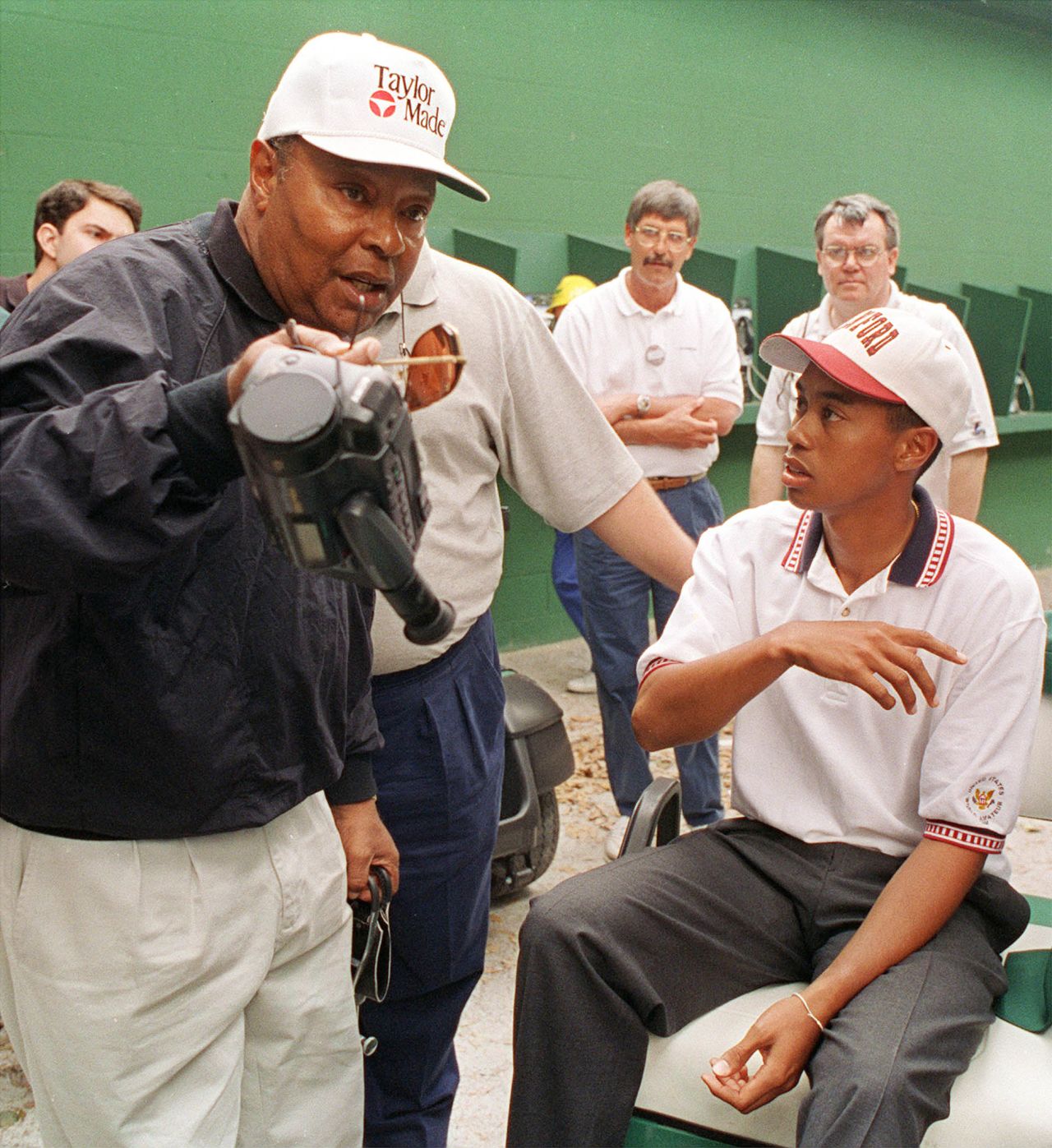 Woods talks with his father, Earl Woods, who features prominently in the HBO documentary 'Tiger.'
