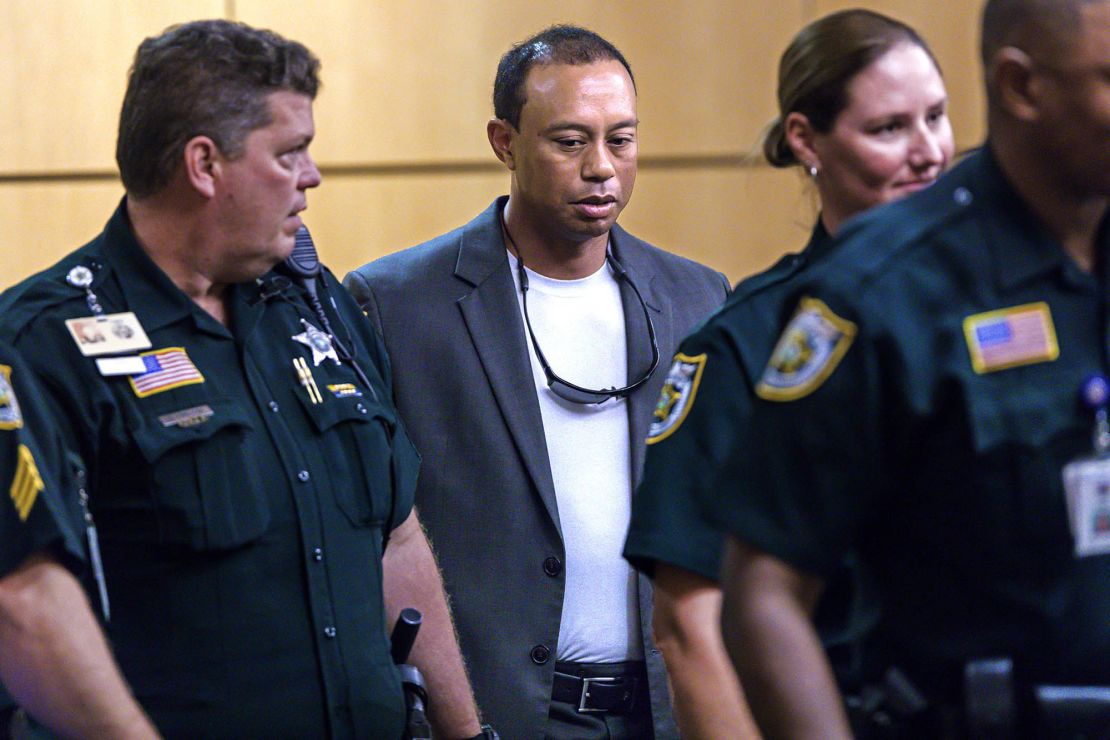 Woods (C) appears in Palm Beach County court October 27, 2017 in Palm Beach Gardens, Florida. He later pled guilty to a second-degree misdemeanor reckless driving charge.