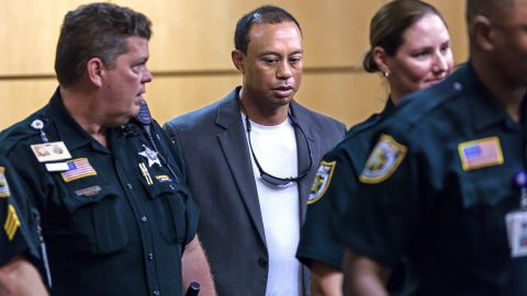 Woods (C) appears in Palm Beach County court October 27, 2017 in Palm Beach Gardens, Florida. He later pled guilty to a second-degree misdemeanor reckless driving charge.