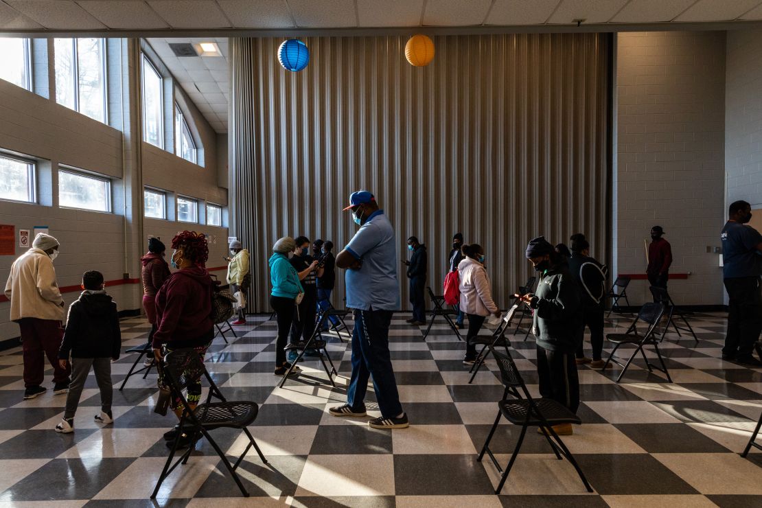 Voters stand in line to cast ballots during the Senate runoff elections in Atlanta on January 5. Georgia voters turned out in record numbers to elect two Democrats and swing the balance of power in the US Senate.