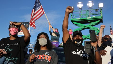 Supporters attend a campaign rally for Democratic Senate candidates Jon Ossoff and Rev. Raphael Warnock on January 4, 2021 -- the day before their runoff election in Atlanta.