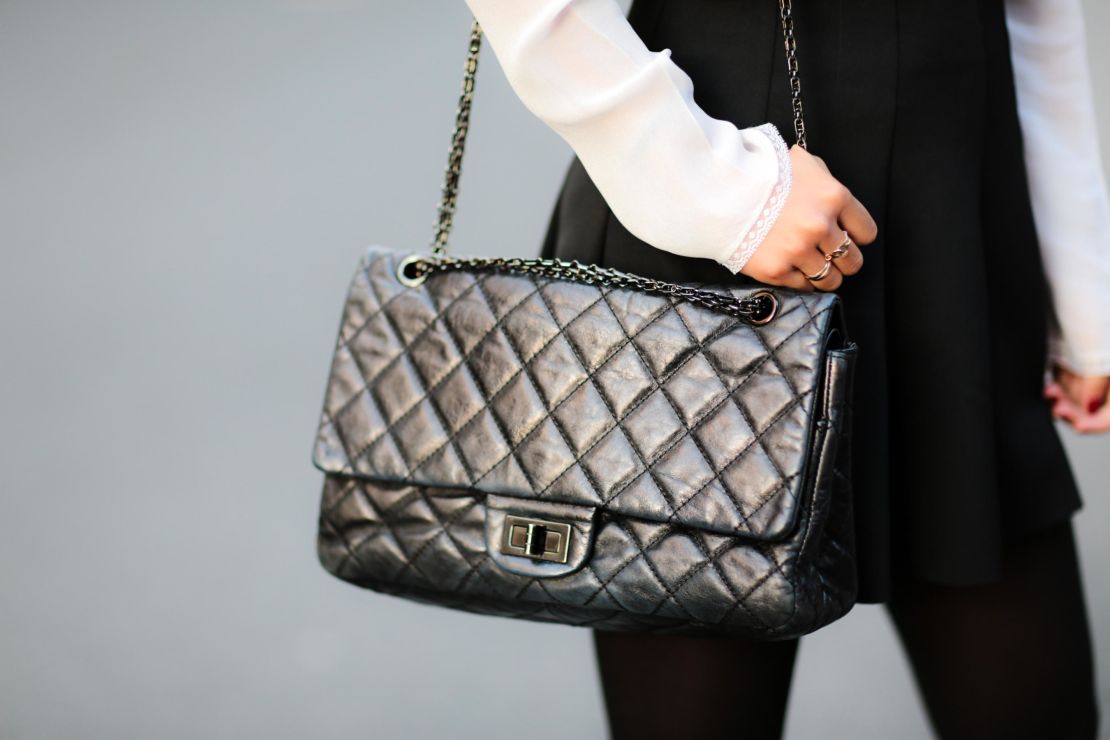 Fashion and lifestyle blogger May Berthelot sporting a Chanel 2.55 bag in Paris, France.