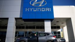 A potential car buyer enters a Hyundai Motor Co. Tuscon compact sports utility vehicle (SUV) on the lot of the Keyes Hyundai dealership in the Van Nuys neighborhood of Los Angeles, California, U.S., on Saturday, Jan. 2, 2016. Ward's Automotive Group is scheduled to release U.S. monthly total and domestic auto sales on Jan. 5. Photographer: Patrick T. Fallon/Bloomberg via Getty Images