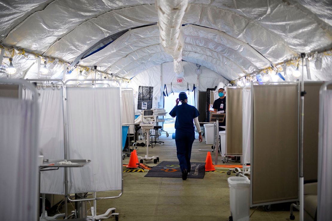 Registered nurse Kennoka Williamson attends to patients in a suspected Covid-19 patient triage area set up outside the Martin Luther King Jr. Community Hospital on January 6 in Los Angeles.