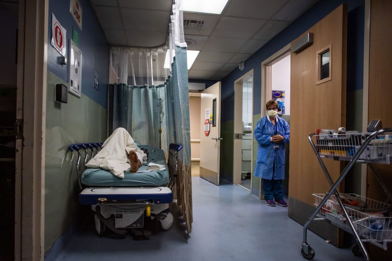 A patient rests in a corridor, waiting for a room at Providence Cedars-Sinai Tarzana Medical Center, a hospital in Tarzana, California, on Sunday, January 3. California reported Sunday that 45,352 more people had tested positive for Covid-19, continuing <a href="https://www.cnn.com/2021/01/03/health/us-coronavirus-sunday/index.html" target="_blank">a surge</a> that has pushed hospitals and their exhausted staff to the brink.