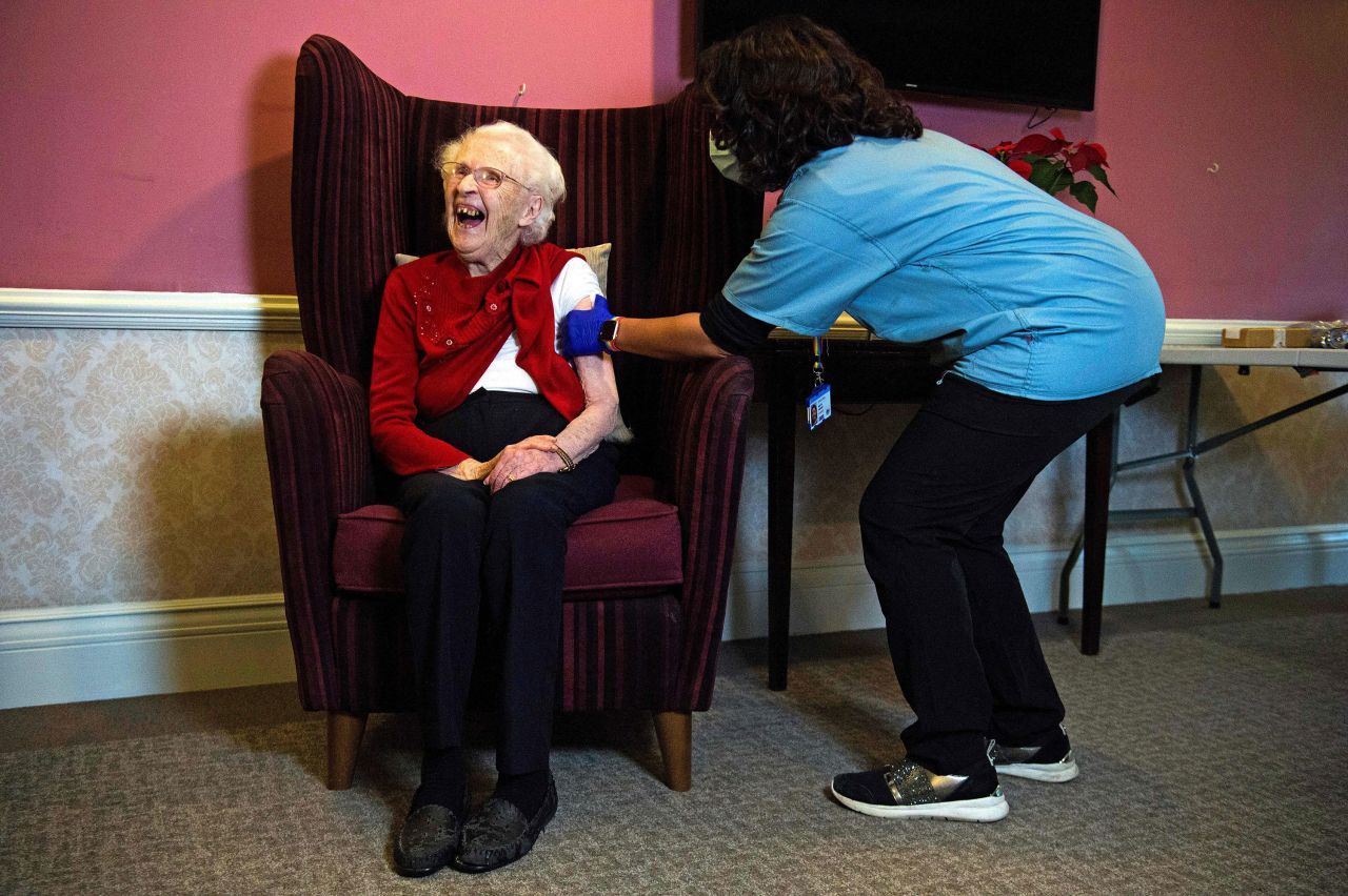 Ellen Prosser, 100, receives the Oxford/AstraZeneca coronavirus vaccine at a Sunrise Care Home in London on Thursday, January 7. The United Kingdom <a href="https://www.cnn.com/2021/01/04/uk/uk-oxford-astrazeneca-oxford-intl/index.html" target="_blank">became the first nation to inoculate people with this vaccine out of trials.</a> The Oxford/AstraZeneca vaccine is easier to transport and to store than the Pfizer/BioNTech vaccine that was approved for use in the UK last month.