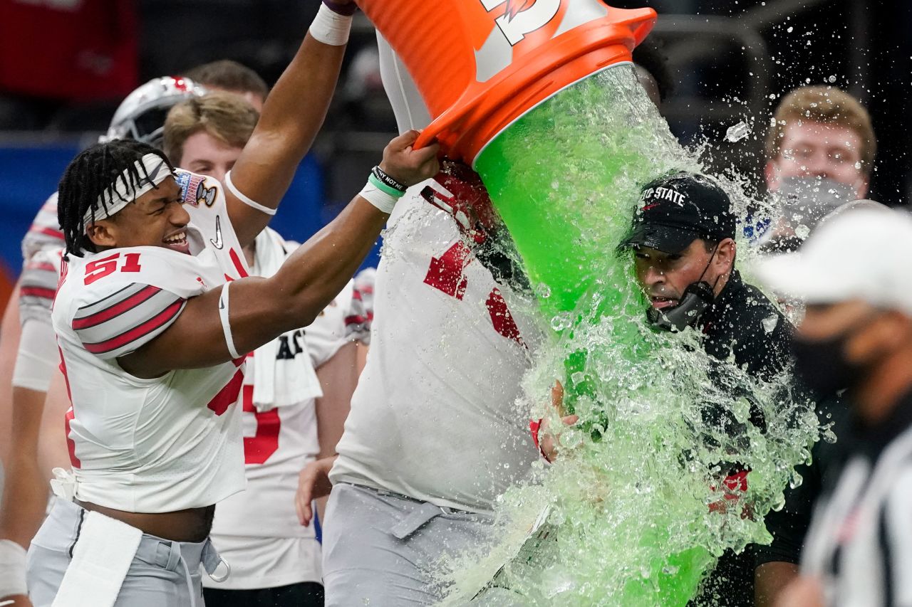 Ohio State head coach Ryan Day gets a Gatorade shower after the Buckeyes defeated Clemson in the semifinals of the College Football Playoff on Friday, January 1.