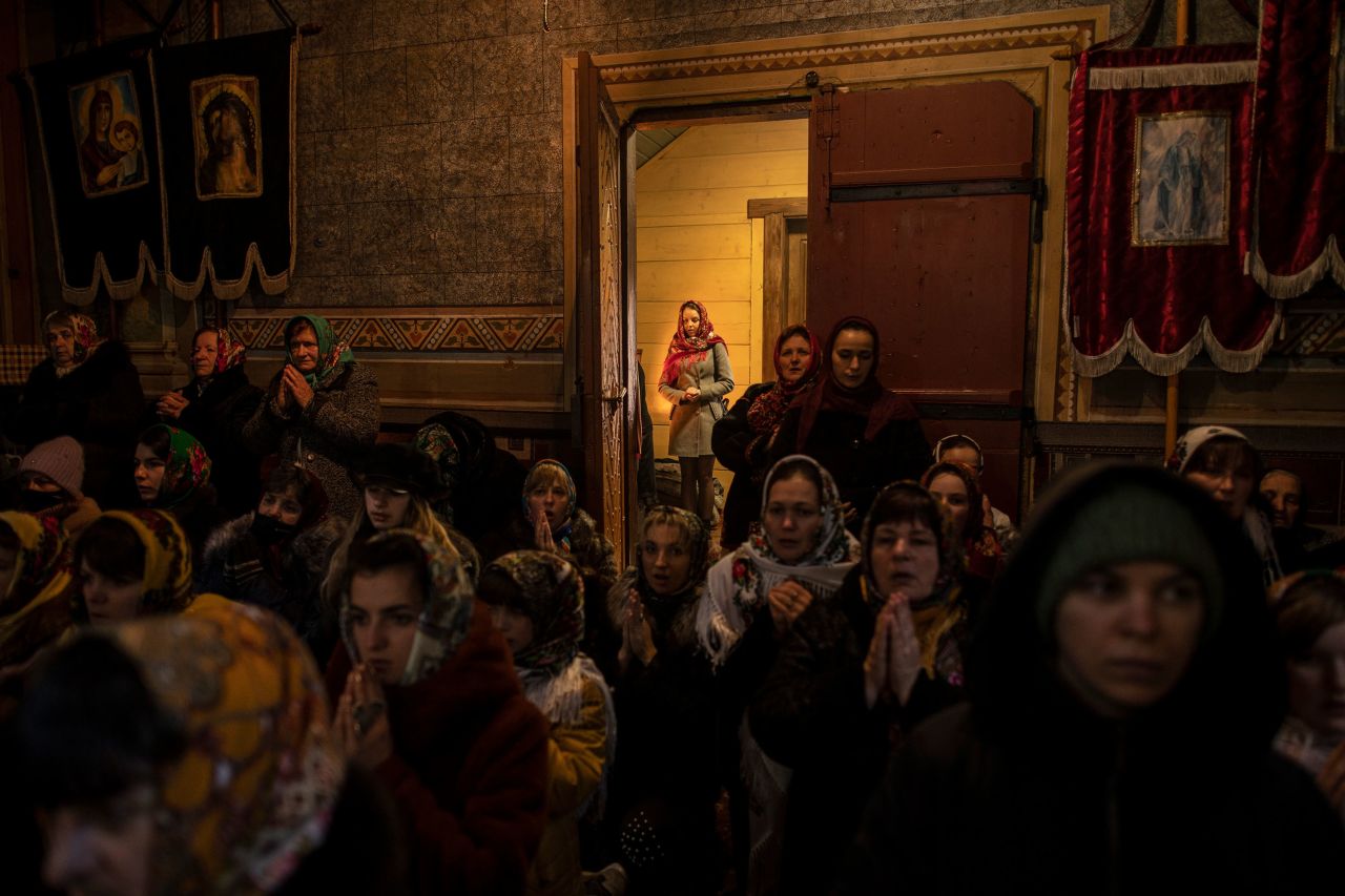 Parishioners attend an Orthodox Christmas Mass at a church in the Ukrainian village of Iltsi on Thursday, January 7.