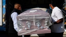 EDITORS NOTE: Graphic content / An empty casket is delivered amid a surge of Covid-19 deaths to the Continental Funeral Home on December 31, 2020 in East Los Angeles, California. - The funeral home currently has about 150 families awaiting services for their loved ones. (Photo by Patrick T. Fallon / AFP) (Photo by PATRICK T. FALLON/AFP via Getty Images)