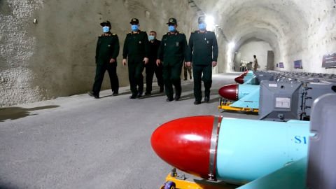 Iranian commanders walk past missiles at the base, in a photo released by Sepahnews, the website of the Revolutionary Guards. 
