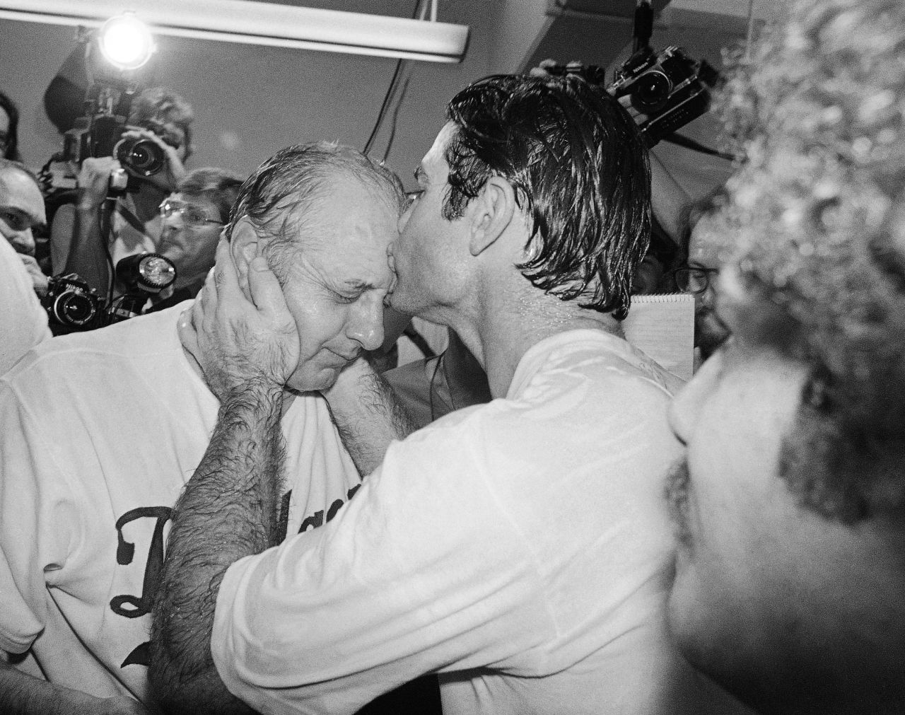 First baseman Steve Garvey kisses Lasorda in the Dodger Stadium locker room after the Dodgers beat the Philadelphia Phillies to win the National League pennant in October 1978.