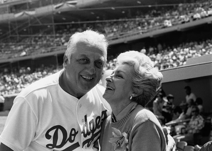 Jo, Lasorda's wife, leans to give him a good luck kiss on the start of his 35th season with the Dodger organization in April 1984. They were married for more than 60 years and had two children.
