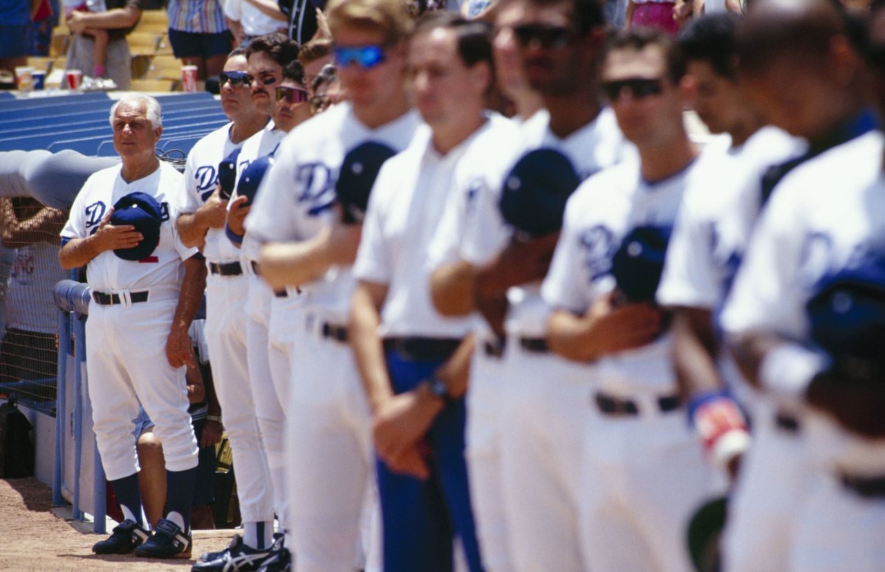 Lasorda, far left, stands with his team during a tribute to former Brooklyn Dodgers catcher Roy Campanella before a game against the Chicago Cubs in June 1993.