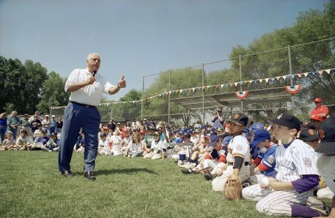 Lasorda speaks with players of the Sunrise Little League in the Woodland Hills area of Los Angeles in April 1995.<br />
