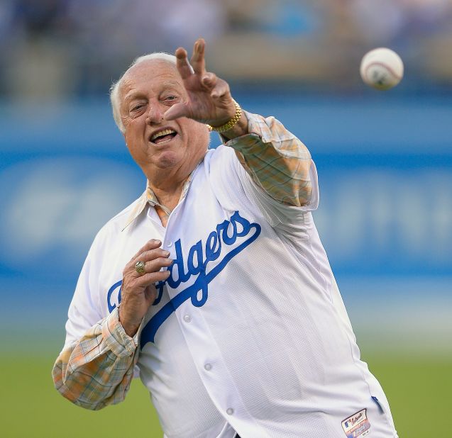 Lasorda throws out the ceremonial first pitch before Game 4 of the National League baseball championship series against the St. Louis Cardinals in October 2013, in Los Angeles.