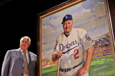 Lasorda stands next to his portrait at the Smithsonian's National Portrait Gallery in Washington, DC, in September 2009.