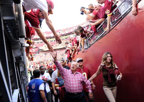 Lasorda greets fans before an NFL game between the Washington Redskins (known today as Washington Football Team) and the Philadelphia Eagles in September 2013 in Landover, Maryland.