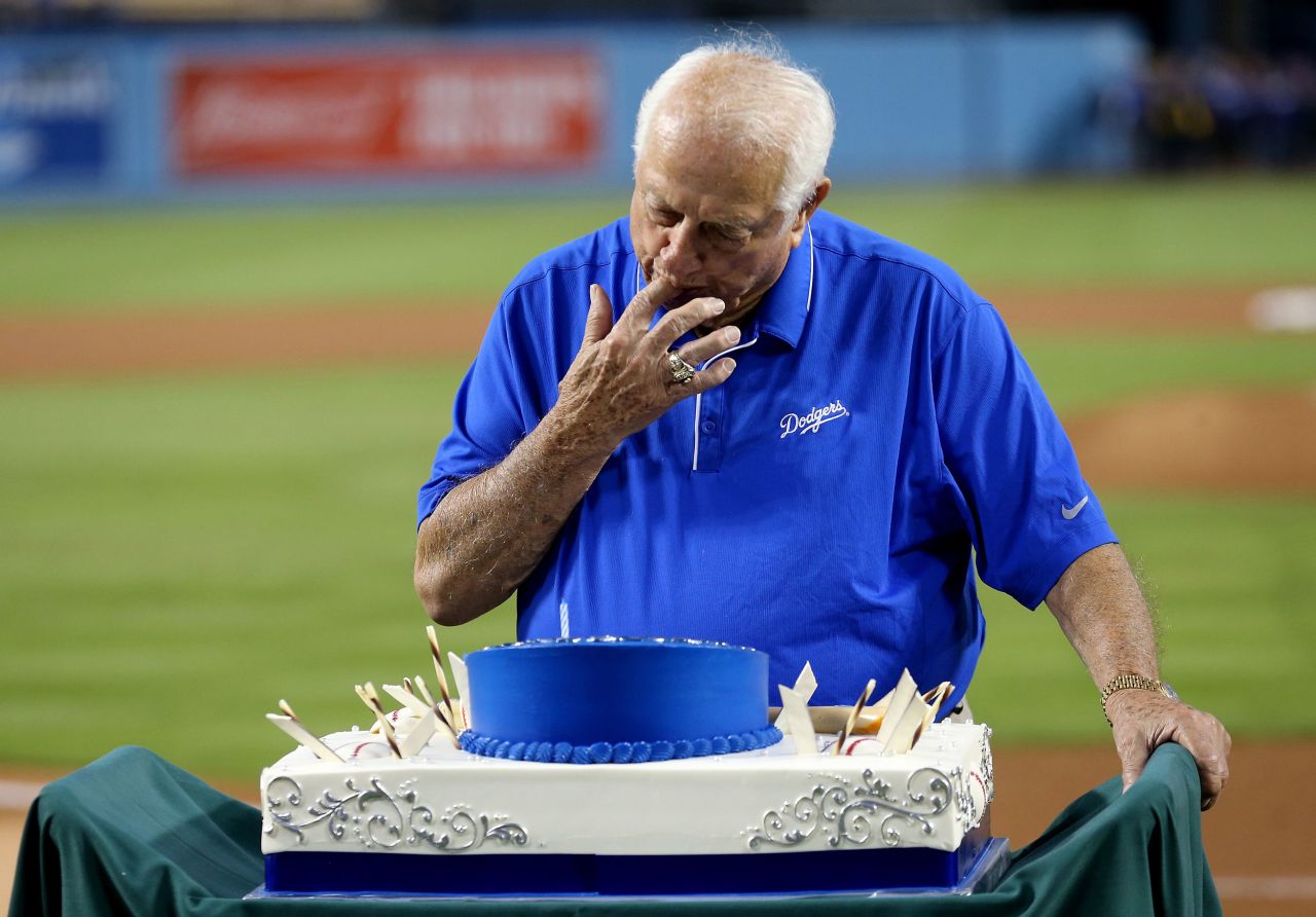 Lasorda, then an executive of the Dodgers, tastes his cake during a ceremony celebrating his 88th birthday before a game against the Arizona Diamondbacks on September 22, 2015.