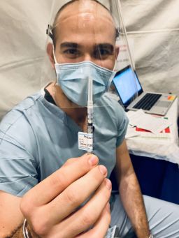 The writer holds the second dose of the Covid-19 vaccine before receiving it at UCLA Medical Center January 7.