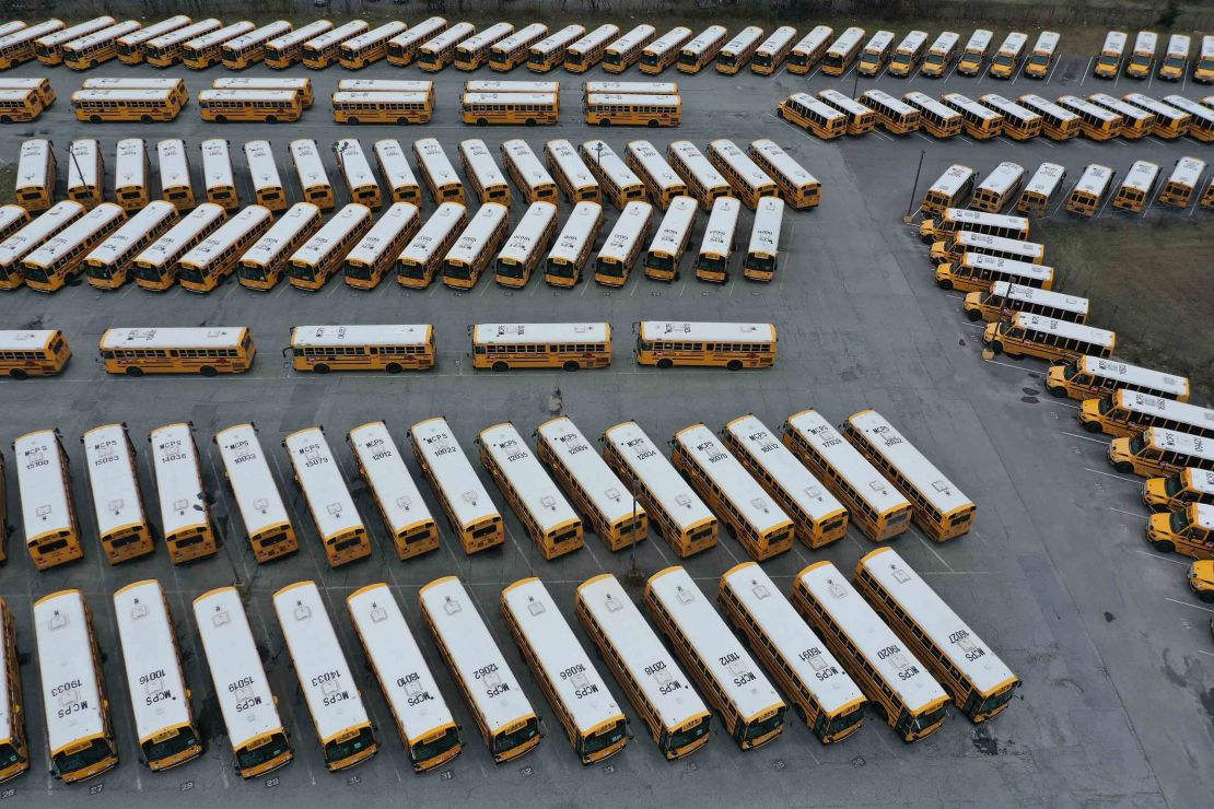 About 200 school buses are parked at a bus depot in Clarksburg, Maryland, on March 16, 2020, idled by the statewide closing of schools in response to the  coronavirus outbreak.