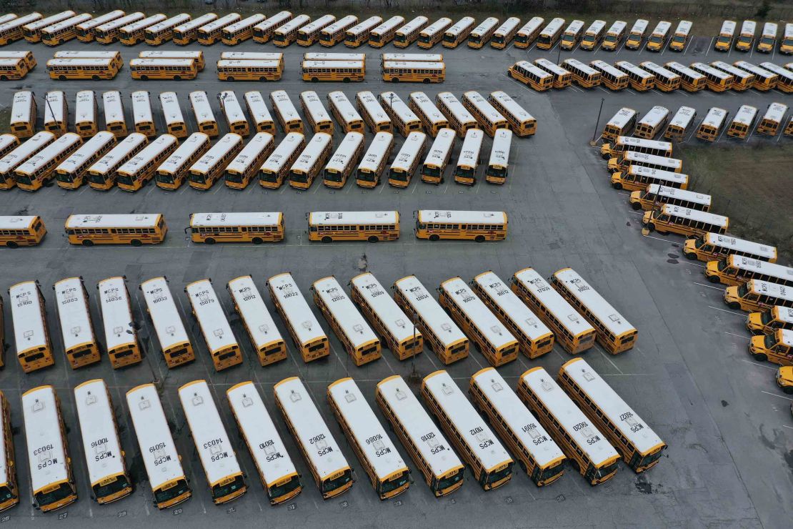 About 200 school buses are parked at a bus depot in Clarksburg, Maryland, on March 16, 2020, idled by the statewide closing of schools in response to the coronavirus outbreak.