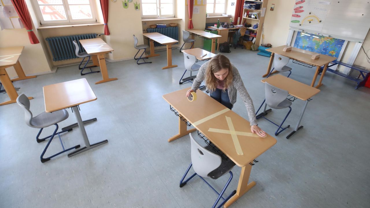 Staff tape off social-distancing markings during preparations for reopening the temporarily closed Schloss-Schule elementary school on April 21, 2020 in Heppenheim, Germany.