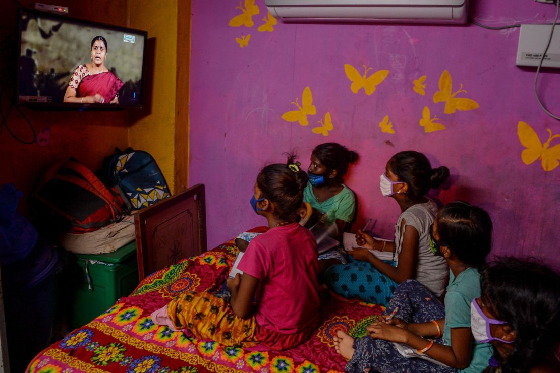 Children attend a tele-learning class at their home via the Kalvi TV channel, an initiative set up to help students while schools are closed by the pandemic in Chennai, India, on July 15, 2020.