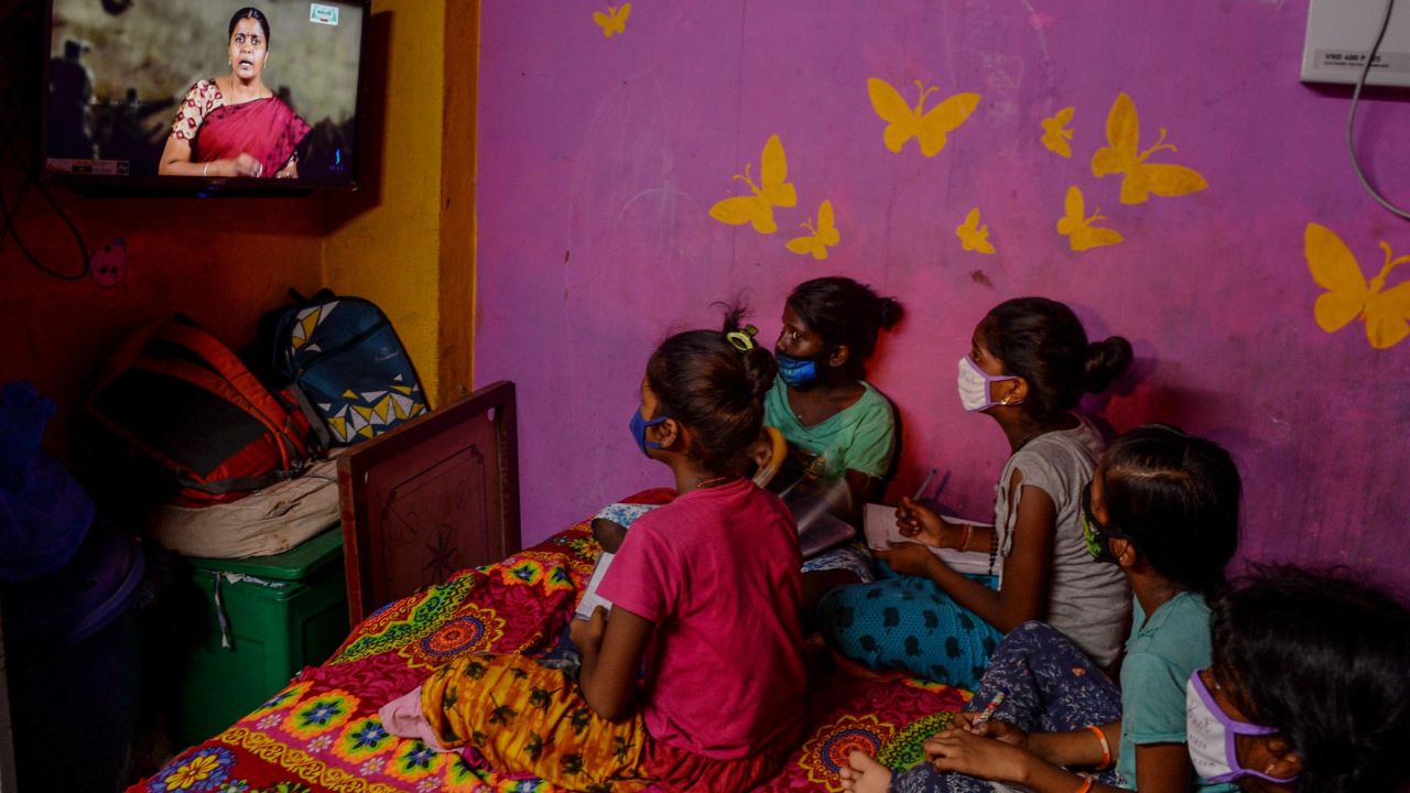Children attend a tele-learning class at their home via the Kalvi TV channel, an initiative set up to help students while schools are closed by the pandemic in Chennai, India, on July 15, 2020.