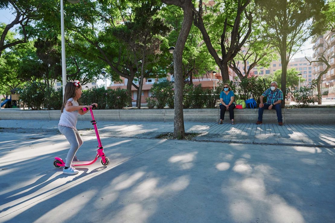 Vaccinated grandparents who want to visit with grandkids who havn't received the vaccine can safely meet outdoors, with everyone 6 feet apart, advised CNN Medical Analyst Dr. Leana Wen.
