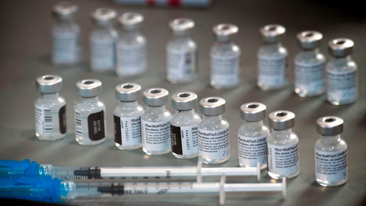 Syringes wand vials of the Pfizer-BioNTech Covid-19 vaccine are prepared to be administered to front-line health care workers under an emergency use authorization at a drive up vaccination site from Renown Health in Reno, Nevada on December 17, 2020.