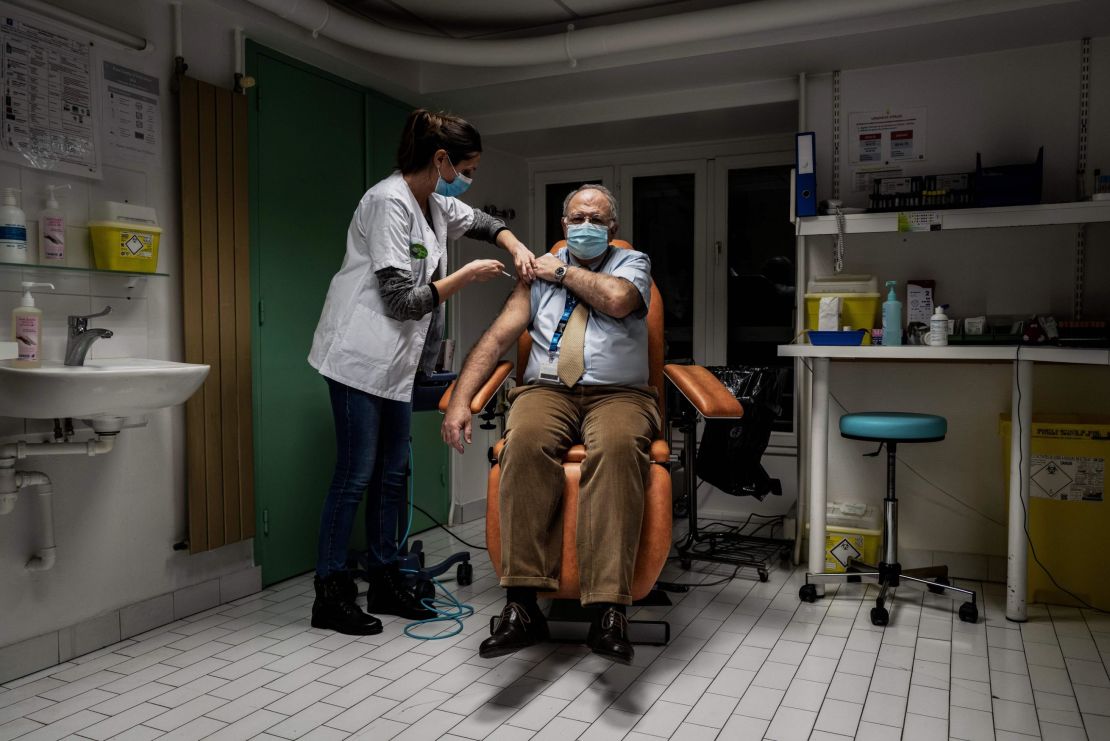 A member of the medical staff at a hospital in Lyon, France receives the Pfizer/BioNTech vaccine on January 6.