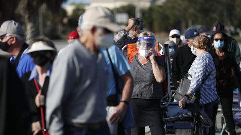 Seniors and first responders wait in line to receive a vaccine in Fort Myers, Florida on December 30.