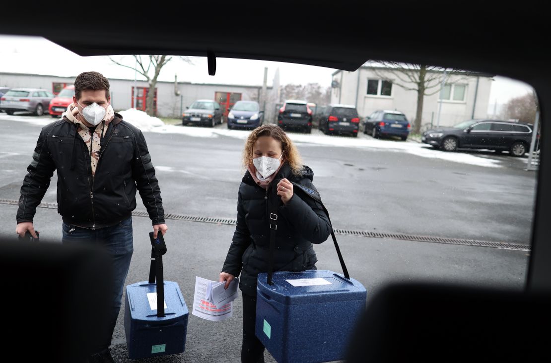 Employees carry boxes with the Pfizer/BioNTech vaccine to a Covid-19 center near Magdeburg, Germany on January 8.