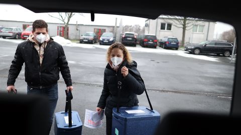 Employees carry boxes with the Pfizer/BioNTech vaccine to a  Covid-19 center near Magdeburg, Germany on January 8.