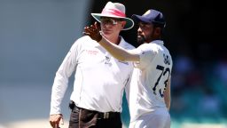 SYDNEY, AUSTRALIA - JANUARY 10: Mohammed Siraj of India stops play to make a formal complaint to Umpire Paul Reiffel about some spectators in the bay behind his fielding position during day four of the Third Test match in the series between Australia and India at Sydney Cricket Ground on January 10, 2021 in Sydney, Australia. (Photo by Cameron Spencer/Getty Images)