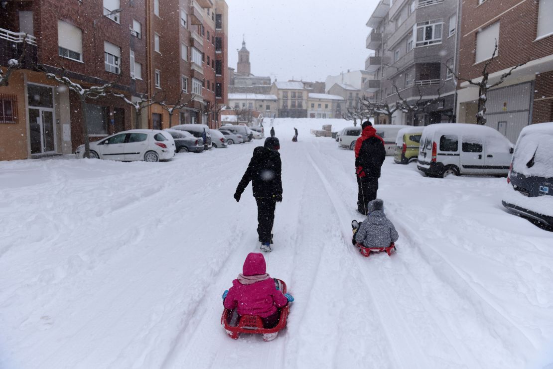 Children play in the snow during the Filomena heavy snowfall in Almazan, Spain.

