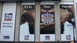 A political display is posted on the outside of the  Fox News headquarters on 6th Avenue in New York July 21, 2020. - A female former producer at Fox News and another woman who appeared frequently as an on-air commentator on the network filed a civil lawsuit on July 20, 2020 accusing former longtime anchor Ed Henry of rape, sexual misconduct and harassment. Prominent Fox News commentators Sean Hannity, Tucker Carlson and Howard Kurtz are also named as defendants in the suit and are accused of sexual misconduct. (Photo by TIMOTHY A. CLARY / AFP) (Photo by TIMOTHY A. CLARY/AFP via Getty Images)