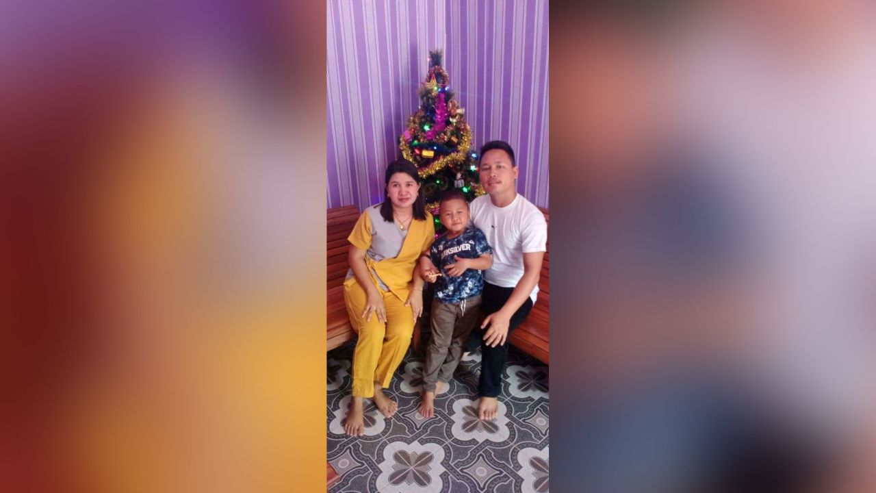 Yohanes Suherdi, 30, poses with his wife, Susilawati Bungahilaria, and their 5-year-old son, Rian Gusti Rafael, in this Christmas portrait.