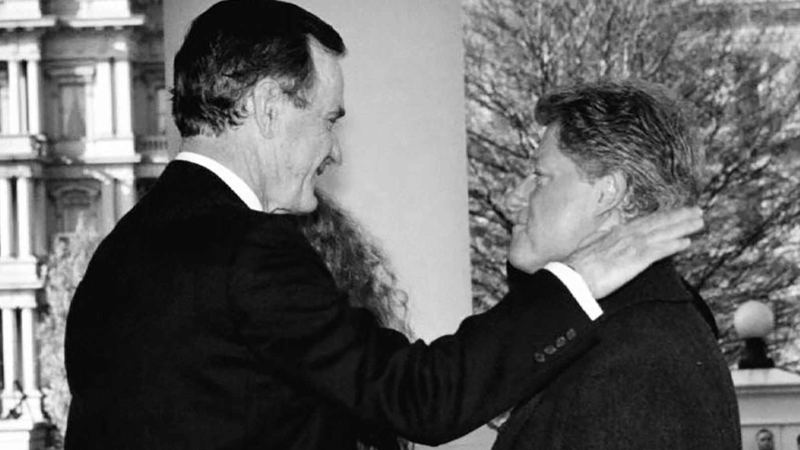 President George H.W. Bush greets President-elect Bill Clinton upon his arrival to the White House on Inauguration Day in 1993.