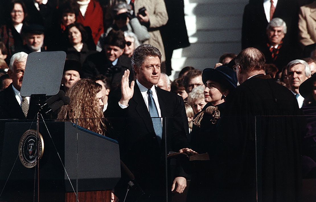 Bill Clinton, standing between Hillary Rodham Clinton and Chelsea Clinton, takes the oath of office of President of the United States on Jan. 20, 1993.