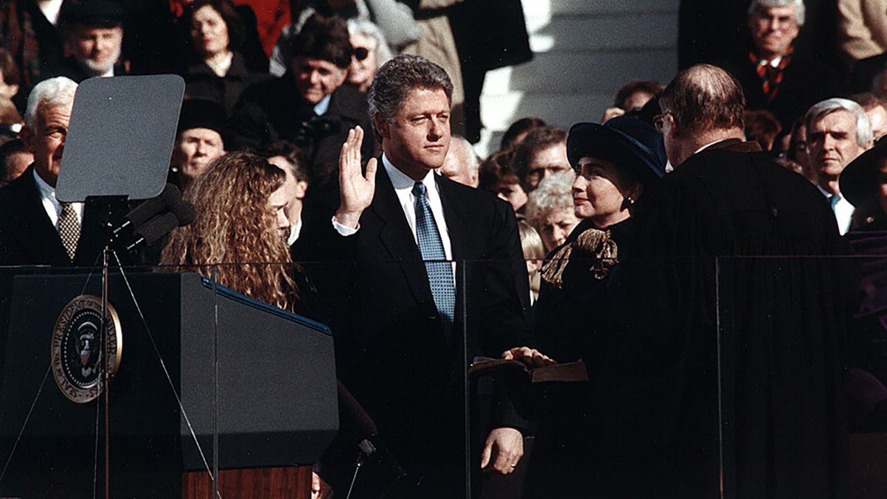 Bill Clinton, standing between Hillary Rodham Clinton and Chelsea Clinton, takes the oath of office of President of the United States on Jan. 20, 1993.