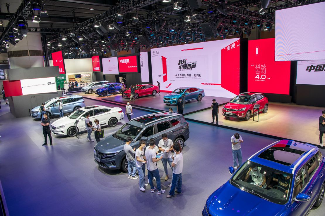 People visit the Geely booth during a car show in Guangzhou, China on November 23, 2020.