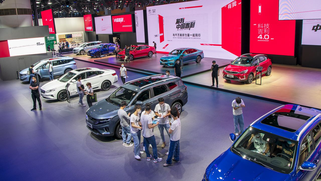 People visit the Geely booth during a car show in Guangzhou, China on November 23, 2020.