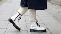 Influencer Jacqueline Zelwis, wearing a long dark blue vest by Gestuz, white pants bei Sezane and black and white boots by Dr. Martens during a street style shooting on October 20, 2020 in Berlin, Germany. (Photo by Streetstyleshooters/Getty Images)