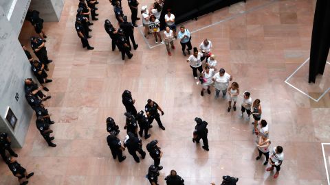 Protesters line up as they're arrested in the Hart Senate Office Building.