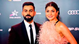 In this photograph taken on September 27, 2019, India's cricketer Virat Kohli with his wife Bollywood actress Anushka Sharma attend the second edition of Indian Sports Honours annual ceremony in Mumbai. (Photo by STR / AFP)        (Photo credit should read STR/AFP via Getty Images)