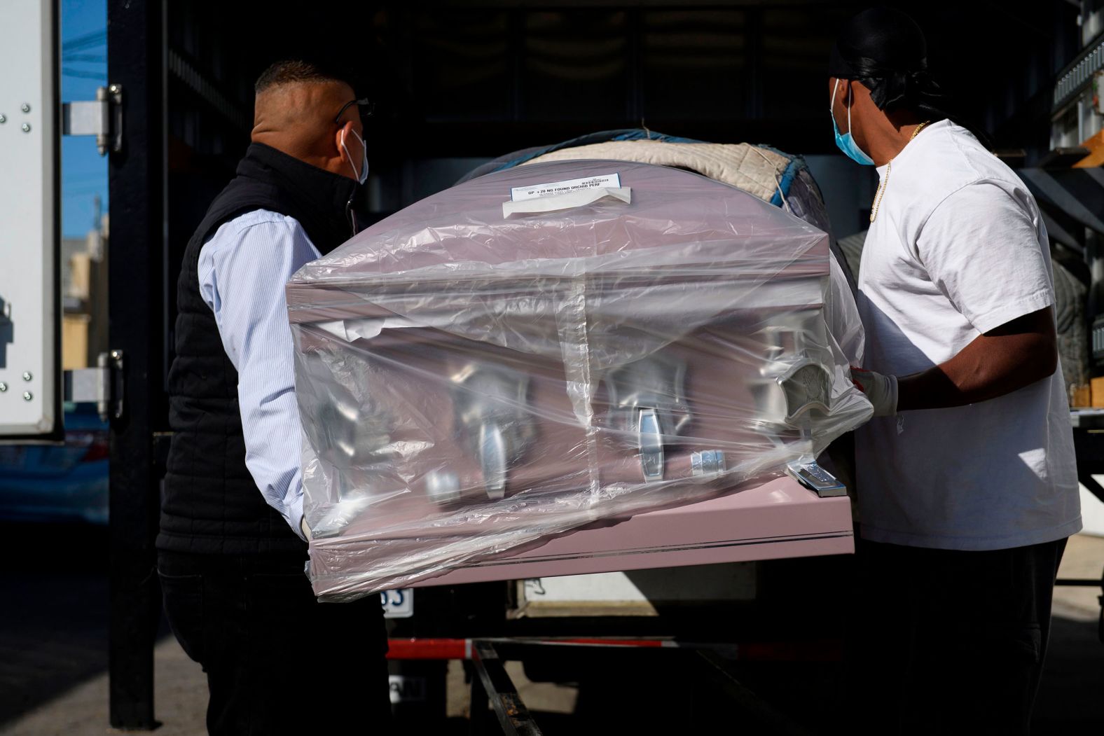 An empty casket is delivered to the Continental Funeral Home in Los Angeles on December 31.